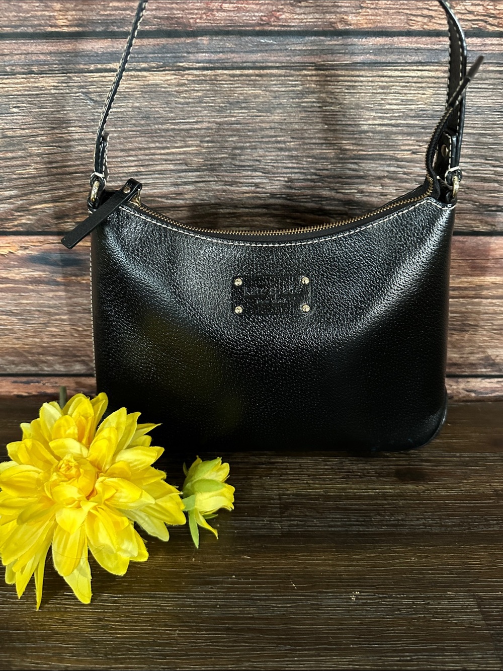 Kate Spade New York black pebbled leather hobo shoulder bag.